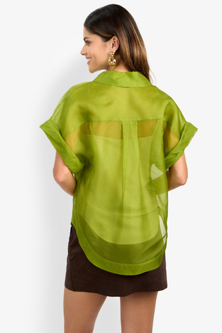 Trina Turk Costanzo Top in Dark Fennel featuring sheer green silk organza, short cuffed sleeves, a button front, and patch pockets.