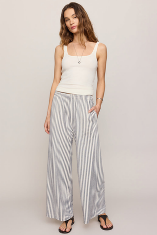 Model wearing the Z Supply Scout Knit Striped Pant in Eclipse featuring a high-rise waist, wide-leg silhouette, and striped knit fabric.