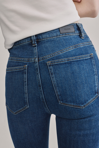 DL1961 Bridget Boot Jean in Night Diner featuring a high-rise bootcut fit, mid-blue wash, and subtle whisker detailing.