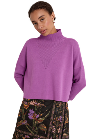Claudie Popover in Iris featuring a cropped purple knit silhouette, mock neckline, and three-quarter batwing sleeves.