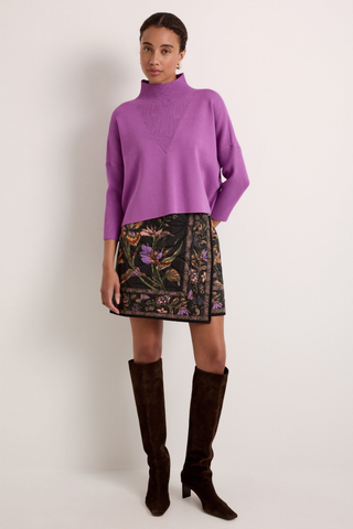 Claudie Popover in Iris featuring a cropped purple knit silhouette, mock neckline, and three-quarter batwing sleeves.