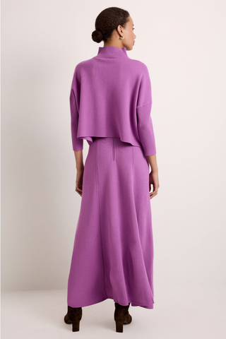 Claudie Popover in Iris featuring a cropped purple knit silhouette, mock neckline, and three-quarter batwing sleeves.