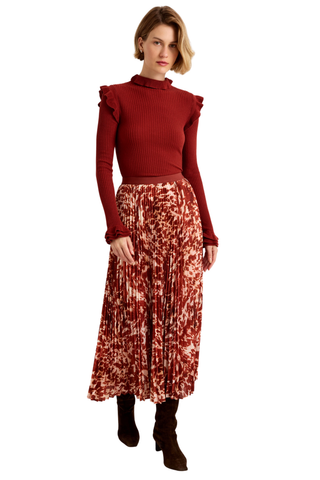 Wesley Skirt in Calico featuring a red and ivory printed pleated maxi silhouette with a contrasting auburn waistband.