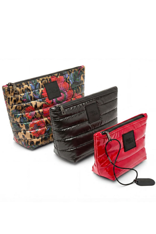 Think Royln Travel Trio set of three quilted pouches in leopard floral, black, and red.