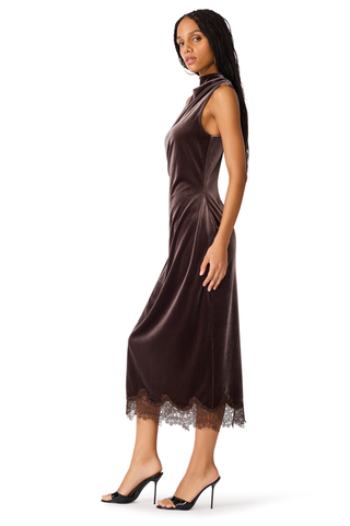 Mo Dress in Dark Toffee featuring rich chocolate-brown velvet, a draped neckline, flattering side ruching, and a delicate lace-trimmed midi hem.