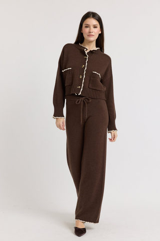 En Saison Victoria Cardigan in Brown featuring contrast edge stitching, a button-front closure, long sleeves, and a relaxed knit silhouette.