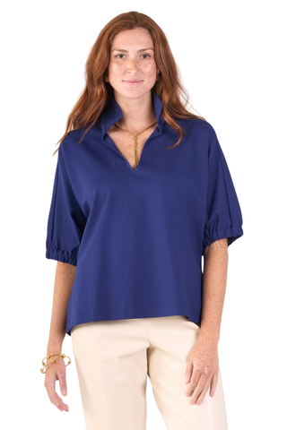 Model wearing the Emily McCarthy Poppy Top in Navy Cotton Poplin with relaxed dolman sleeves and a notched neckline.