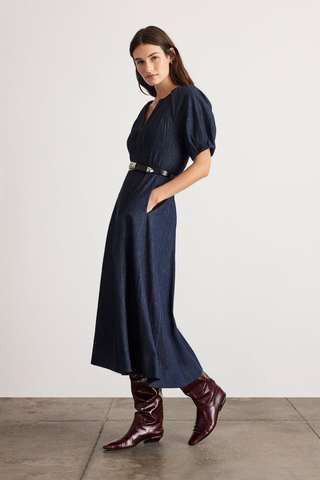 Tanya Taylor Piper Dress in Midnight Rinse dark indigo denim with short puff sleeves and a fit-and-flare midi silhouette.