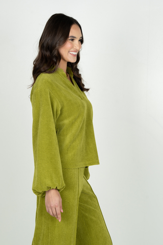 Emily McCarthy Lolli Top in Cardamom green featuring an open neckline, long voluminous sleeves, gathered cuffs, and relaxed fit.