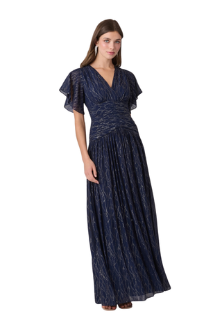Shoshanna Lilly Dress in Indigo Silver and Gold featuring shimmering lurex chiffon, a V-neckline, flutter sleeves, ruched waist, and flowing full-length skirt.