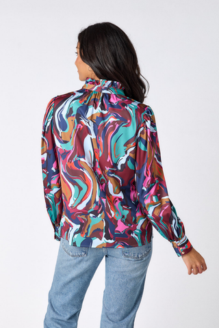 Crosby Lyla Blouse in Color Current featuring a vibrant multicolor print, collared neckline, button front, and long sleeves.