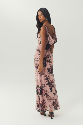 Blush floral sleeveless maxi dress with a flattering bias-cut silhouette.