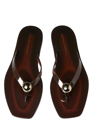 Loeffler Randall Jovie Jelly Flip Flop in brown translucent jelly PVC featuring a square toe, thong sandal silhouette, and signature gold ball detail