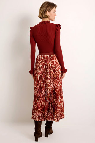 Wesley Skirt in Calico featuring a red and ivory printed pleated maxi silhouette with a contrasting auburn waistband.