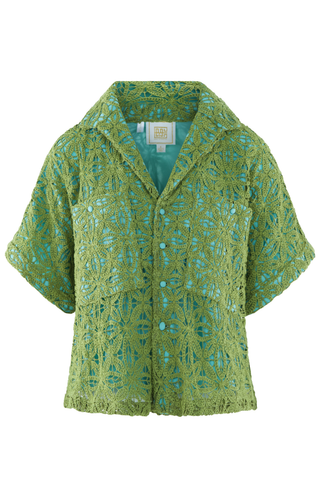 Model wearing the Emily McCarthy Luna Top in Olive Hour featuring olive lace overlay, aqua lining, button-front closure, short sleeves, and a relaxed resort-inspired silhouette