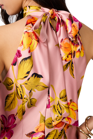 Steve Madden Lara Dress in Tropical Breeze featuring a pink satin floral print, halter neckline, tie-back detail, and maxi silhouette