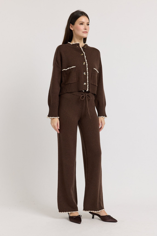 En Saison Victoria Cardigan in Brown featuring contrast edge stitching, a button-front closure, long sleeves, and a relaxed knit silhouette.
