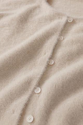 Z Supply Winterglow Fluffy Cardigan in Frosted Pearl featuring a soft beige knit, crew neckline, button front, and long sleeves.