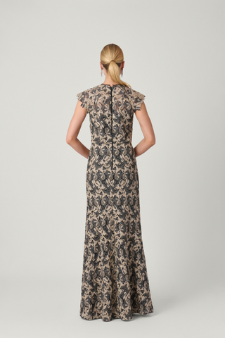Shoshanna Raven Dress in jet black and gold featuring a metallic pattern, fitted silhouette, short sleeves, and floor-length flared hem.