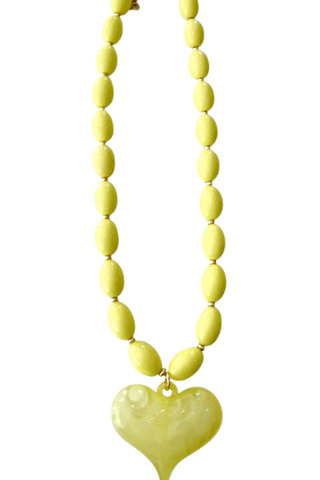 Gemelli Roxie Yellow Beaded Necklace with bright yellow beads and oversized coordinating heart charm.
