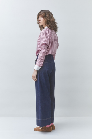 Suncoo Lake Blouse in Rose featuring pink stripes, a pointed collar, button front, long sleeves, and contrast white cuffs.