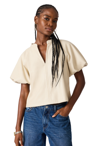 Bone blouse with flutter sleeves and a relaxed draped silhouette.