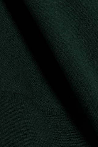 SIMKHAI Janese Off Shoulder Midi Dress in deep Everglade green with long sleeves, a fitted waist, and straight midi skirt.