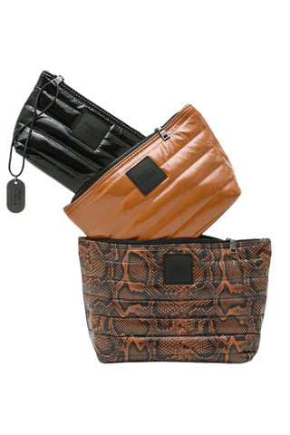 Think Royln Travel Trio set of three quilted pouches in Neo Python print, cocoa brown, and black.