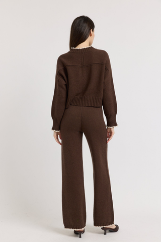 En Saison Victoria Cardigan in Brown featuring contrast edge stitching, a button-front closure, long sleeves, and a relaxed knit silhouette.