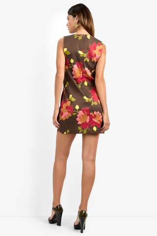 Trina Turk Tahlia 2 Dress in Multi featuring a bold pink, red, and green floral print on a deep brown sleeveless mini silhouette.