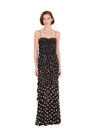 SALONI Niki Maxi Dress in Polka Scatter featuring a black and white polka-dot print, fitted bodice, thin straps, and floor-length skirt.
