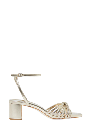 Loeffler Randall Olivia Mid Heel Sandal in champagne metallic leather with a knotted upper, ankle strap, and block heel.