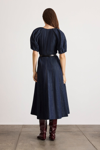 Tanya Taylor Piper Dress in Midnight Rinse dark indigo denim with short puff sleeves and a fit-and-flare midi silhouette.