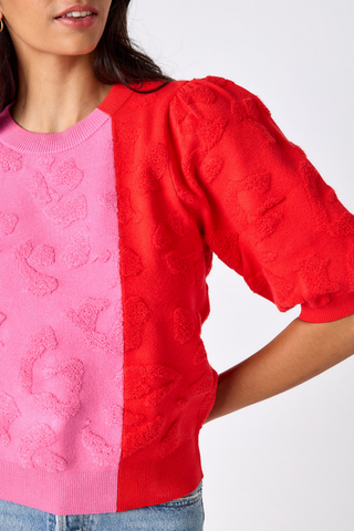 Crosby Smith Sweater in Crosby Colorblock featuring a pink and red colorblock design, crew neckline, and short puff sleeves.