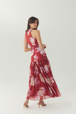 Red and ivory floral sleeveless maxi dress with a flowing skirt.