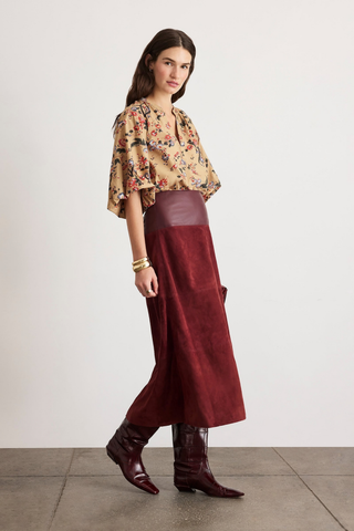 Tanya Taylor Combo Hudson Skirt in Deep Redwood featuring a burgundy suede A-line silhouette with a contrasting leather waistband and front slit.