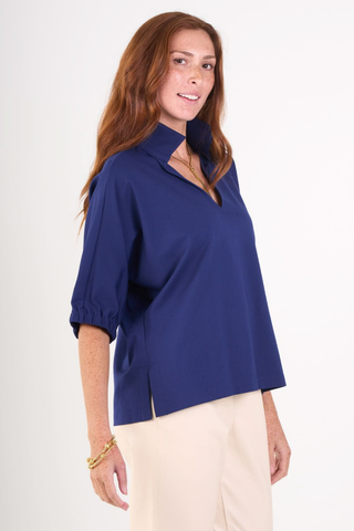 Model wearing the Emily McCarthy Poppy Top in Navy Cotton Poplin with relaxed dolman sleeves and a notched neckline.