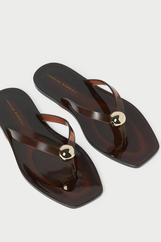 Loeffler Randall Jovie Jelly Flip Flop in brown translucent jelly PVC featuring a square toe, thong sandal silhouette, and signature gold ball detail