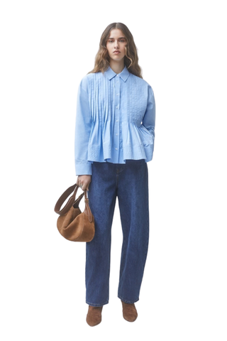Suncoo Loeli Blouse in Bleu Ciel featuring a light blue hue, gathered high neckline, long sleeves, and flowy silhouette.