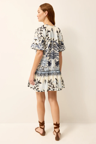 Woman wearing a floral dress on a white background