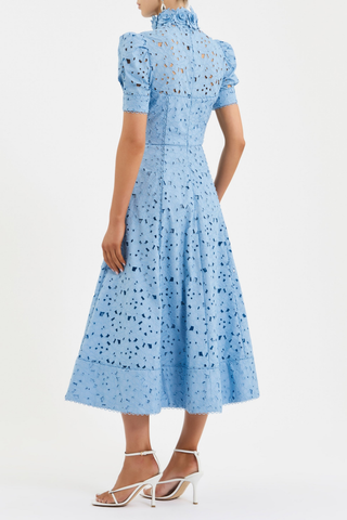 Rebecca Vallance Kitsu Midi Dress in blue broderie anglaise with floral neckline, short sleeves, and full midi skirt