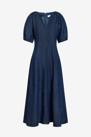 Tanya Taylor Piper Dress in Midnight Rinse dark indigo denim with short puff sleeves and a fit-and-flare midi silhouette.