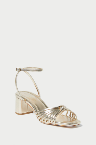 Loeffler Randall Olivia Mid Heel Sandal in champagne metallic leather with a knotted upper, ankle strap, and block heel.