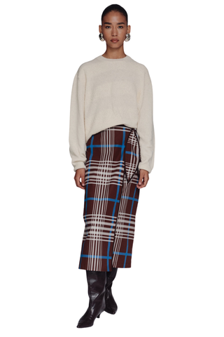 De Loreta Magangue Skirt in Horizonte featuring a multicolor plaid pattern and midi-length silhouette.