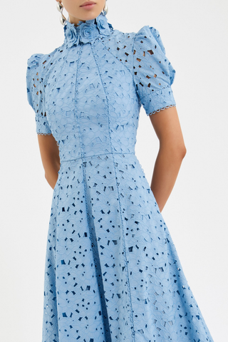 Rebecca Vallance Kitsu Midi Dress in blue broderie anglaise with floral neckline, short sleeves, and full midi skirt