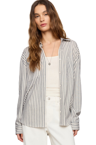 Model wearing the Z Supply Reese Button Up Stripe Top in Eclipse featuring striped knit fabric, long sleeves, and a relaxed fit.