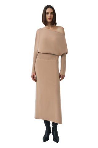 SIMKHAI Janese Off Shoulder Midi Dress in Camel featuring a wide off-the-shoulder neckline, fitted waist, and straight midi skirt.