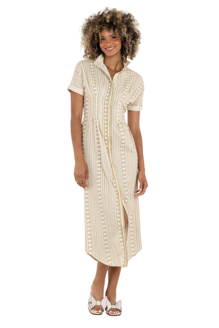 Woman wearing a long, light-colored dress with a white background