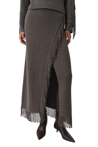 SIMKHAI Casey Midi Skirt in mushroom brown knit with a faux-wrap silhouette and fringe trim along the edge and hem.