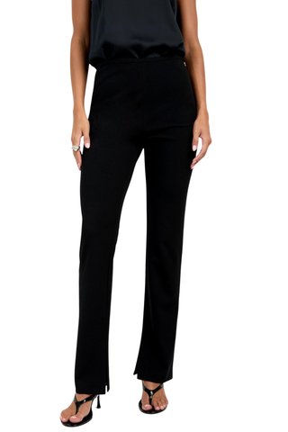 Trina Turk Milena Pant in black featuring a slim-leg silhouette, flat front, side zip closure, and subtle inner hem slits.